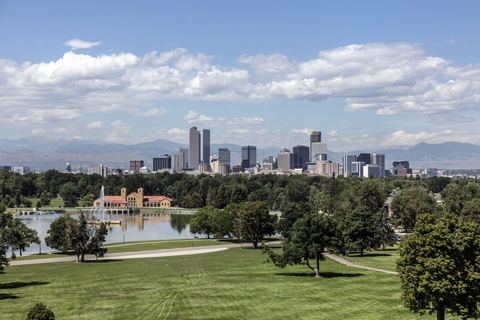 Skyline of Denver across Ferril Lake in City Park.